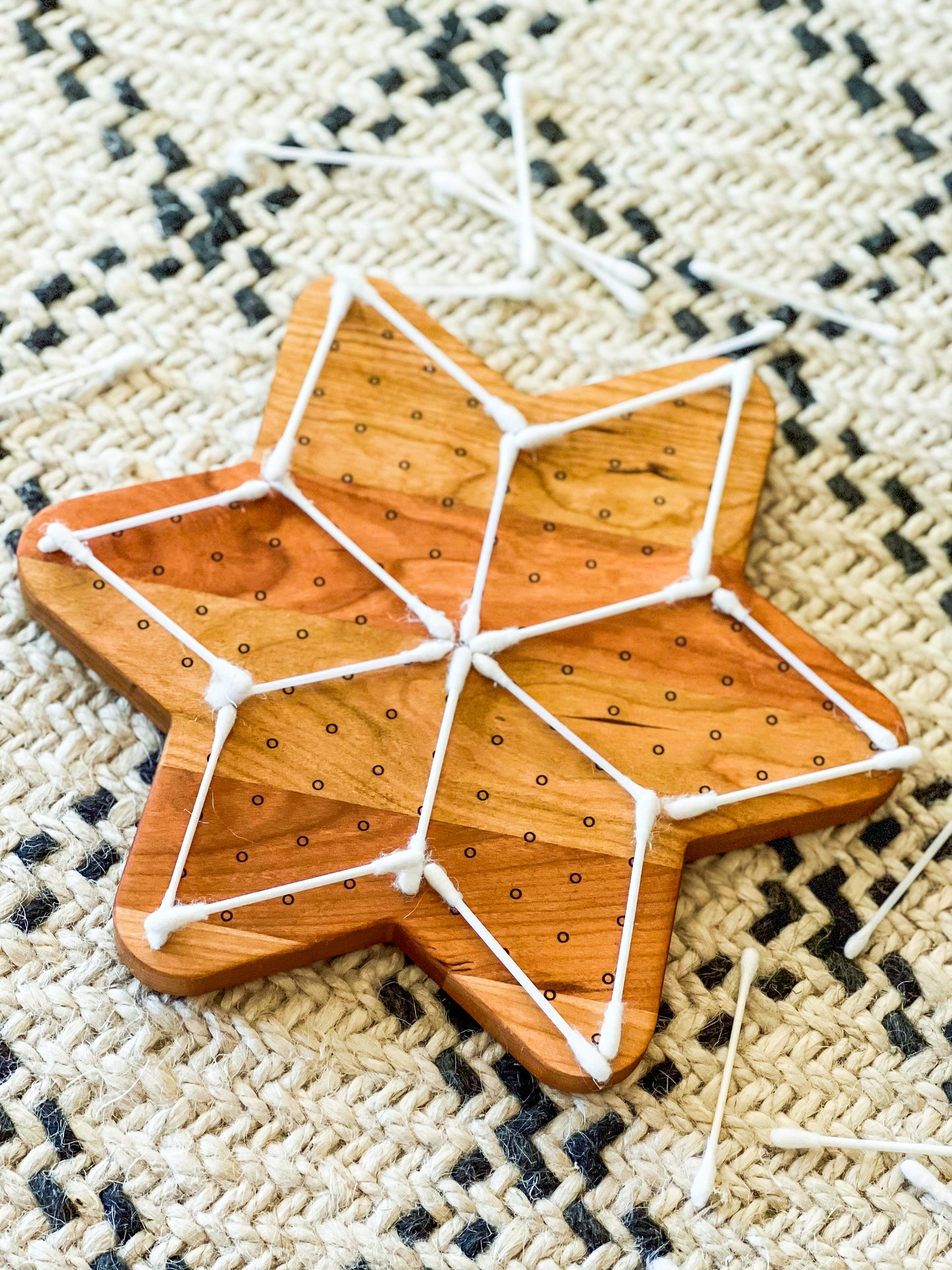Star shaped marble run and dotted geoboard