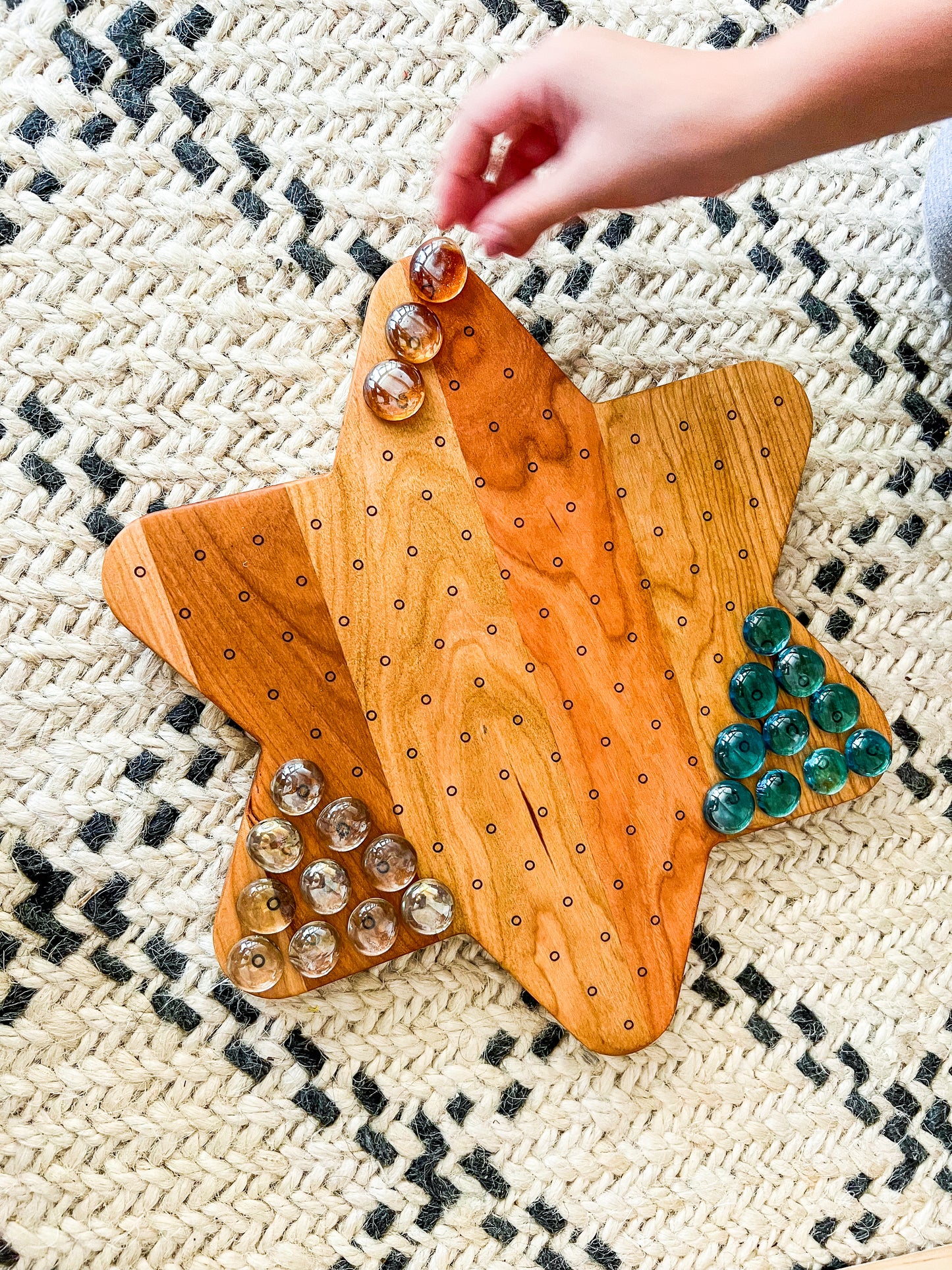 Star shaped marble run and dotted geoboard